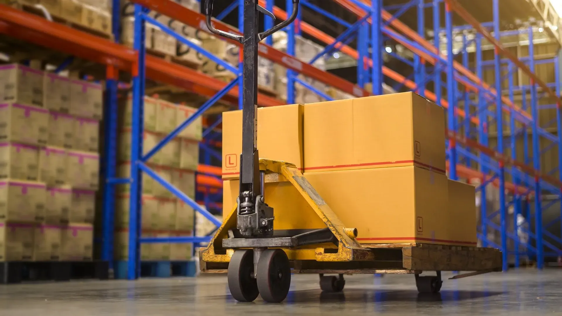 Warehouse forklift moving pallets in distribution center